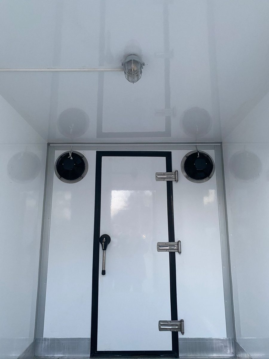 Movable insulated partition with two fans inside a Multi-Temp trailer
